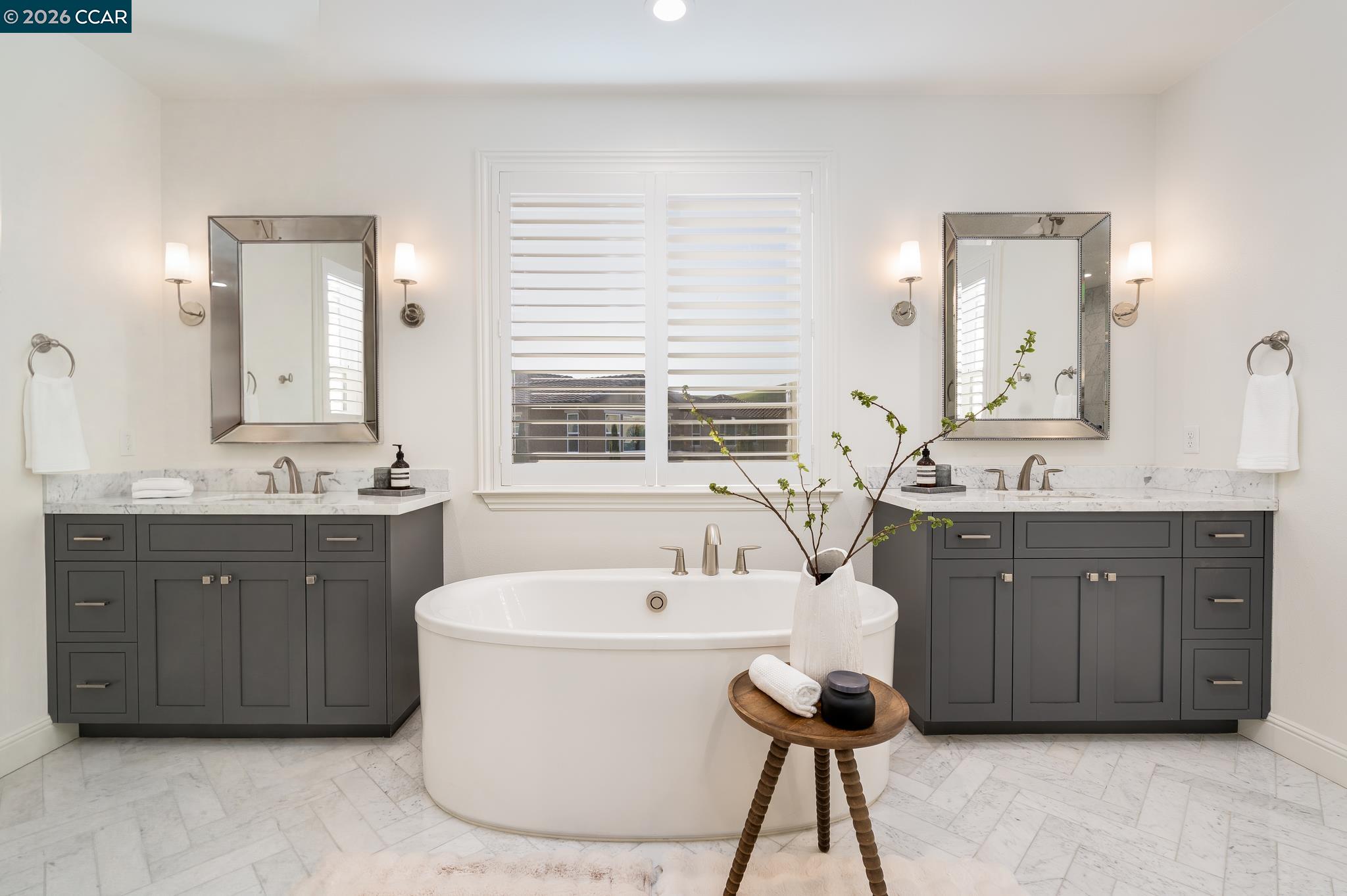 1150 Trumpet Vine Lane San Ramon, CA 94582 - Photo 22 of 45 a spacious bathroom with a tub a double vanity sink a window a mirror and bathtub