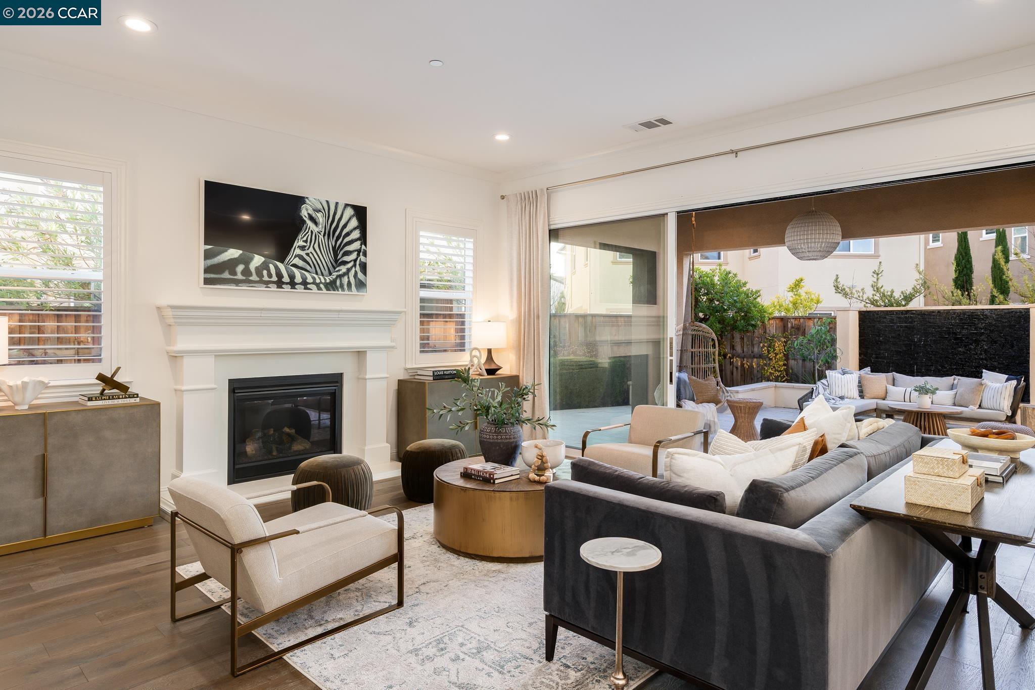 1150 Trumpet Vine Lane San Ramon, CA 94582 - Photo 7 of 45 a living room with furniture large window and a fireplace