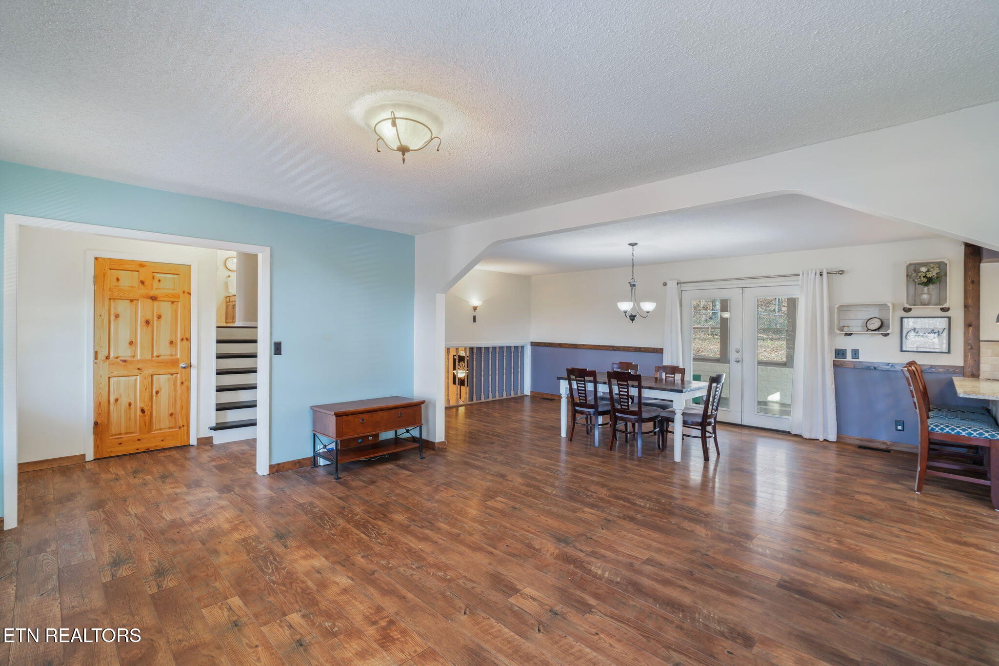 744 Butler Drive Loudon, TN 37774 - Photo 13 of 59 a living room with furniture and a dining table with kitchen view