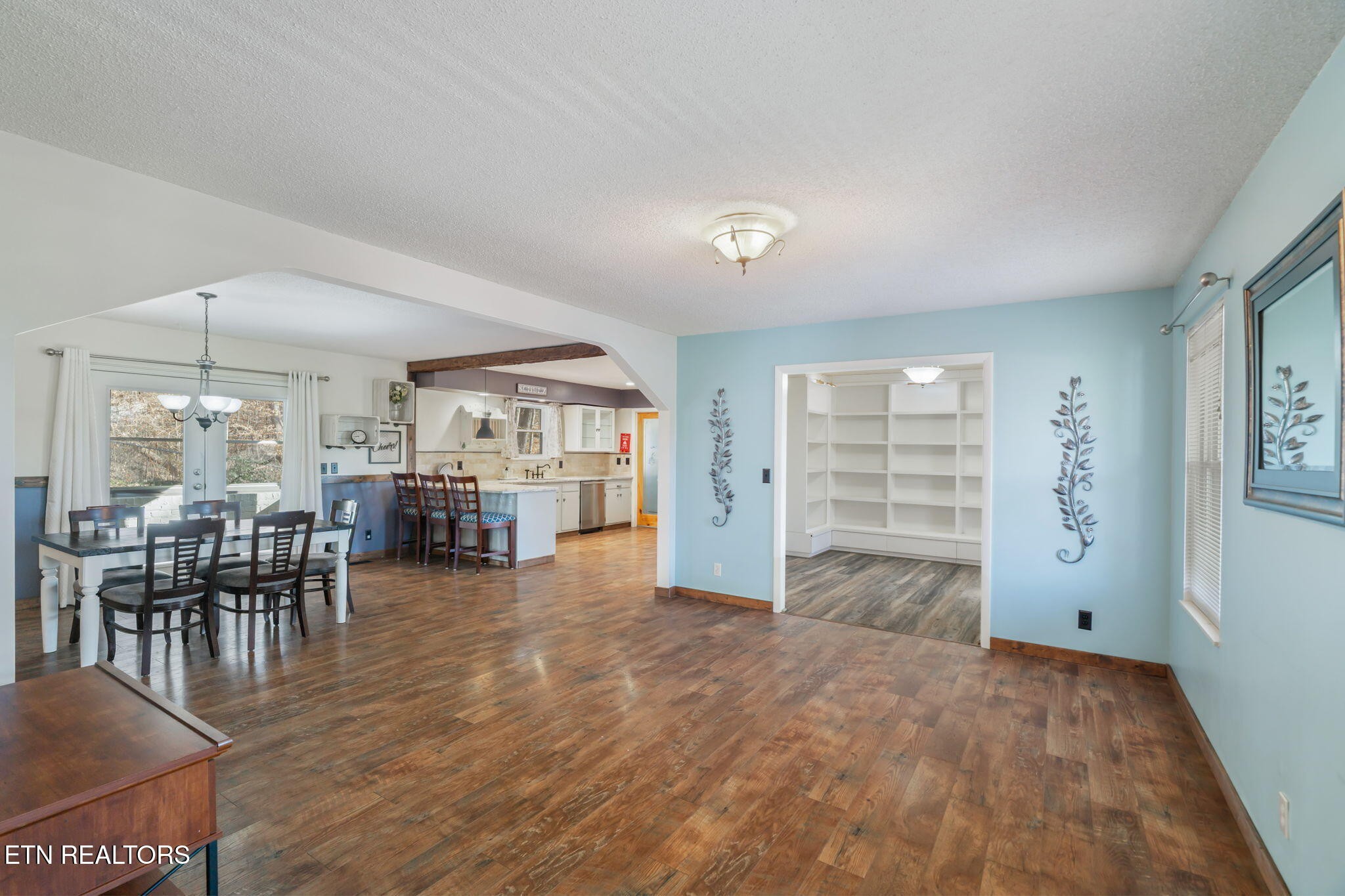 744 Butler Drive Loudon, TN 37774 - Photo 14 of 59 an empty room with furniture and a wooden floor