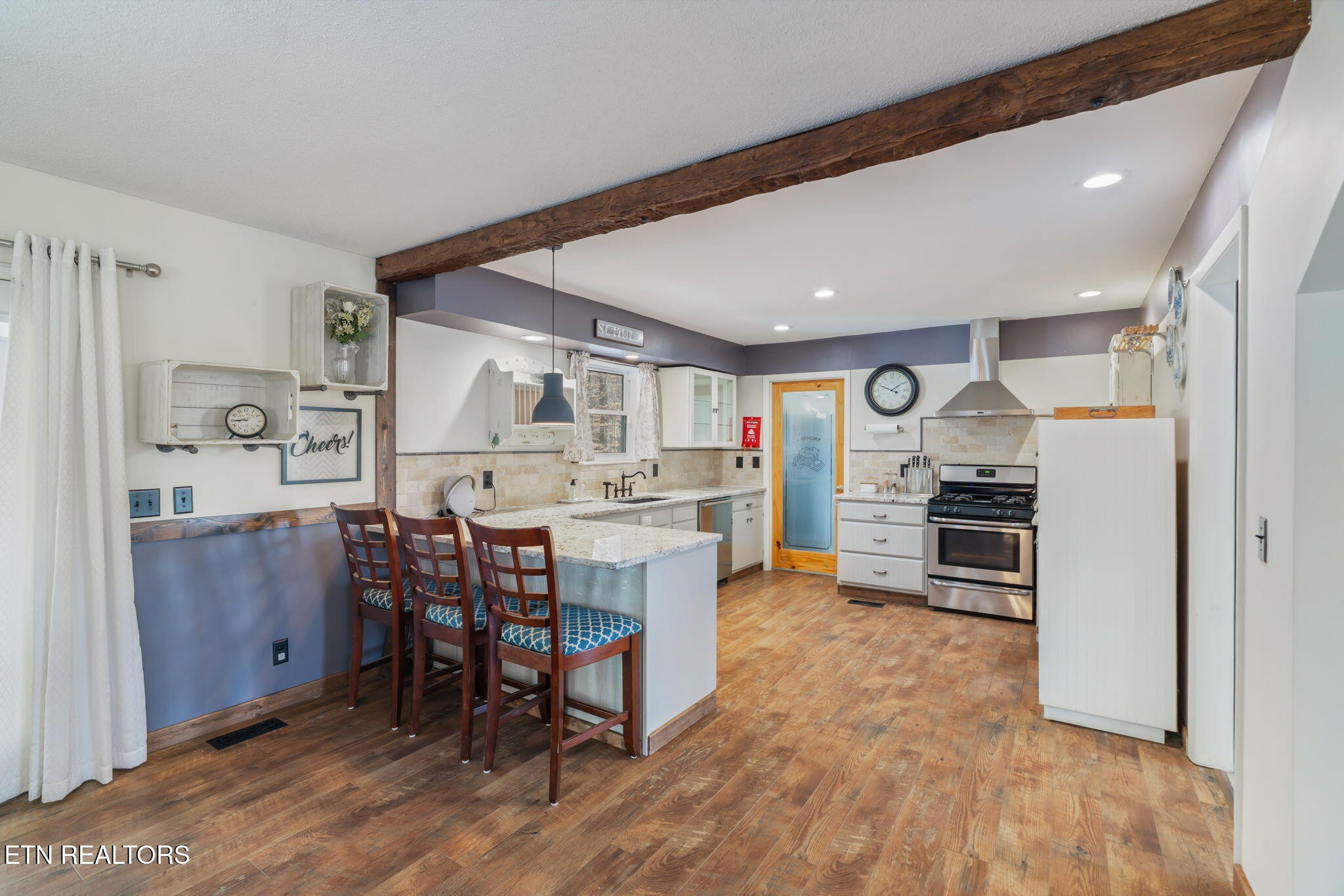 744 Butler Drive Loudon, TN 37774 - Photo 15 of 59 a kitchen with a table and chairs in it