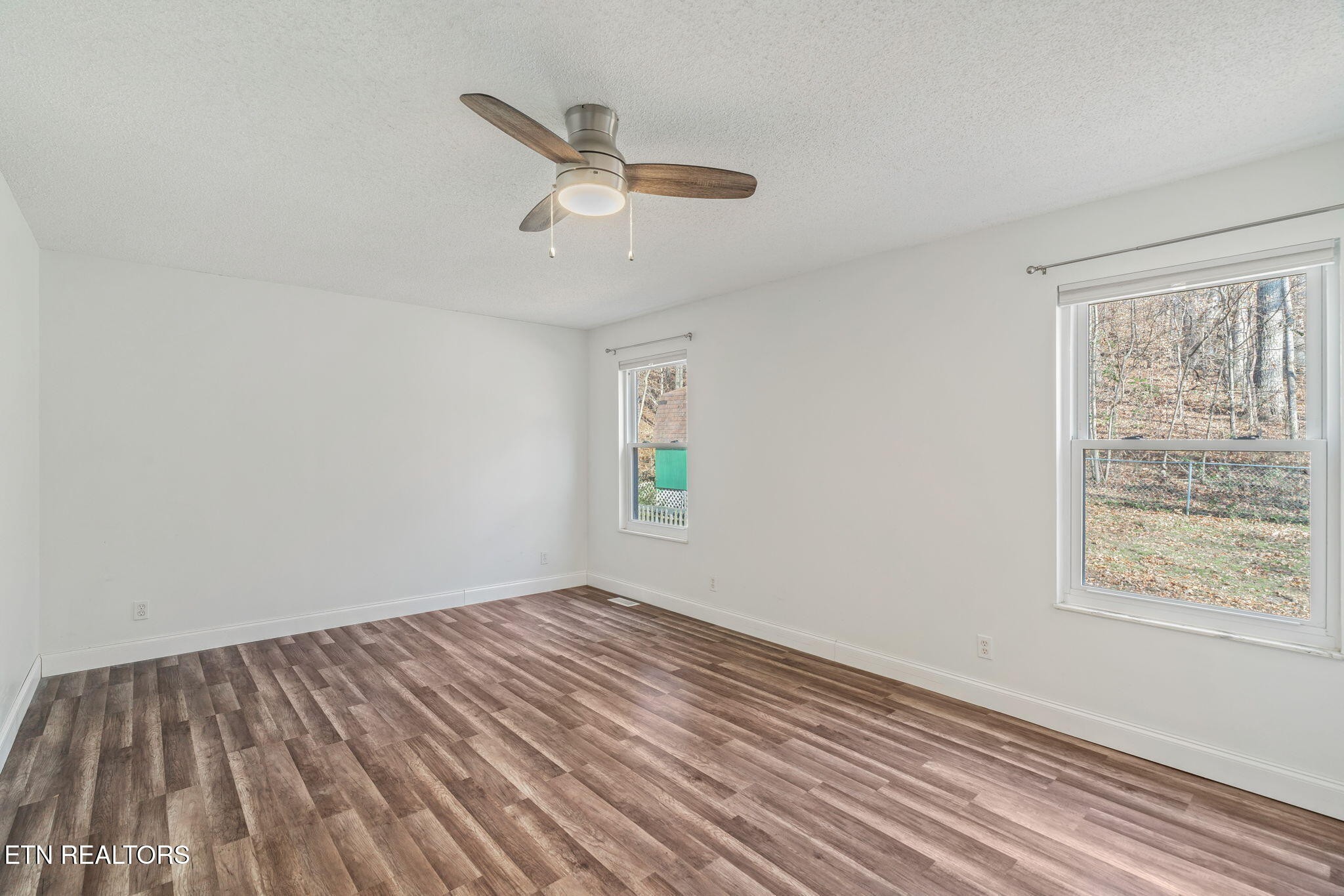 744 Butler Drive Loudon, TN 37774 - Photo 27 of 59 wooden floor in an empty room with a window
