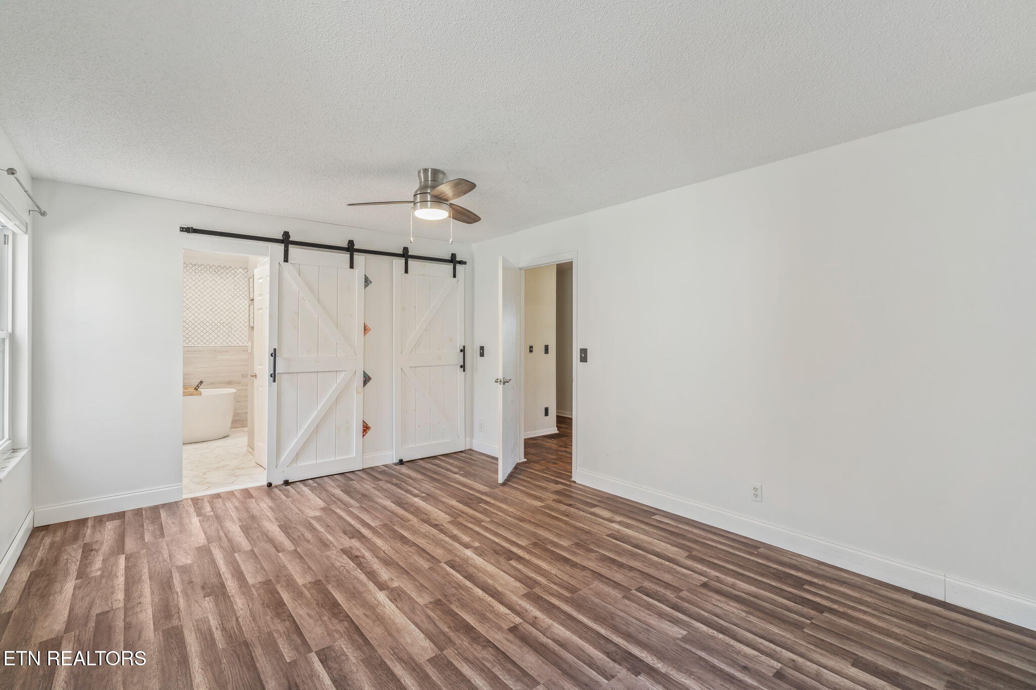 744 Butler Drive Loudon, TN 37774 - Photo 28 of 59 a view of an empty room with wooden floor