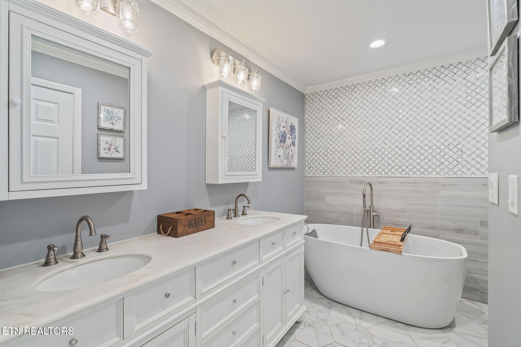 744 Butler Drive Loudon, TN 37774 - Photo 3 of 59 a bathroom with a tub double sink and mirror