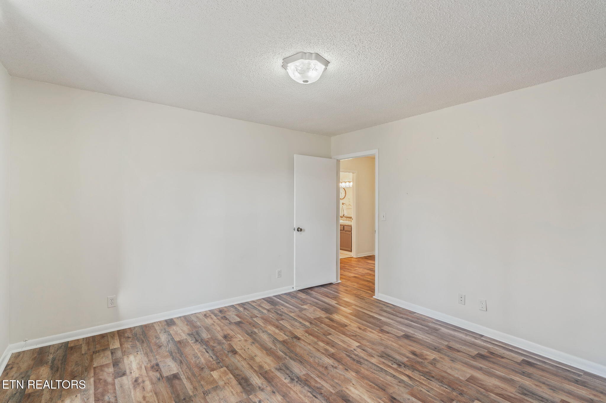 744 Butler Drive Loudon, TN 37774 - Photo 34 of 59 a view of an empty room and wooden floor