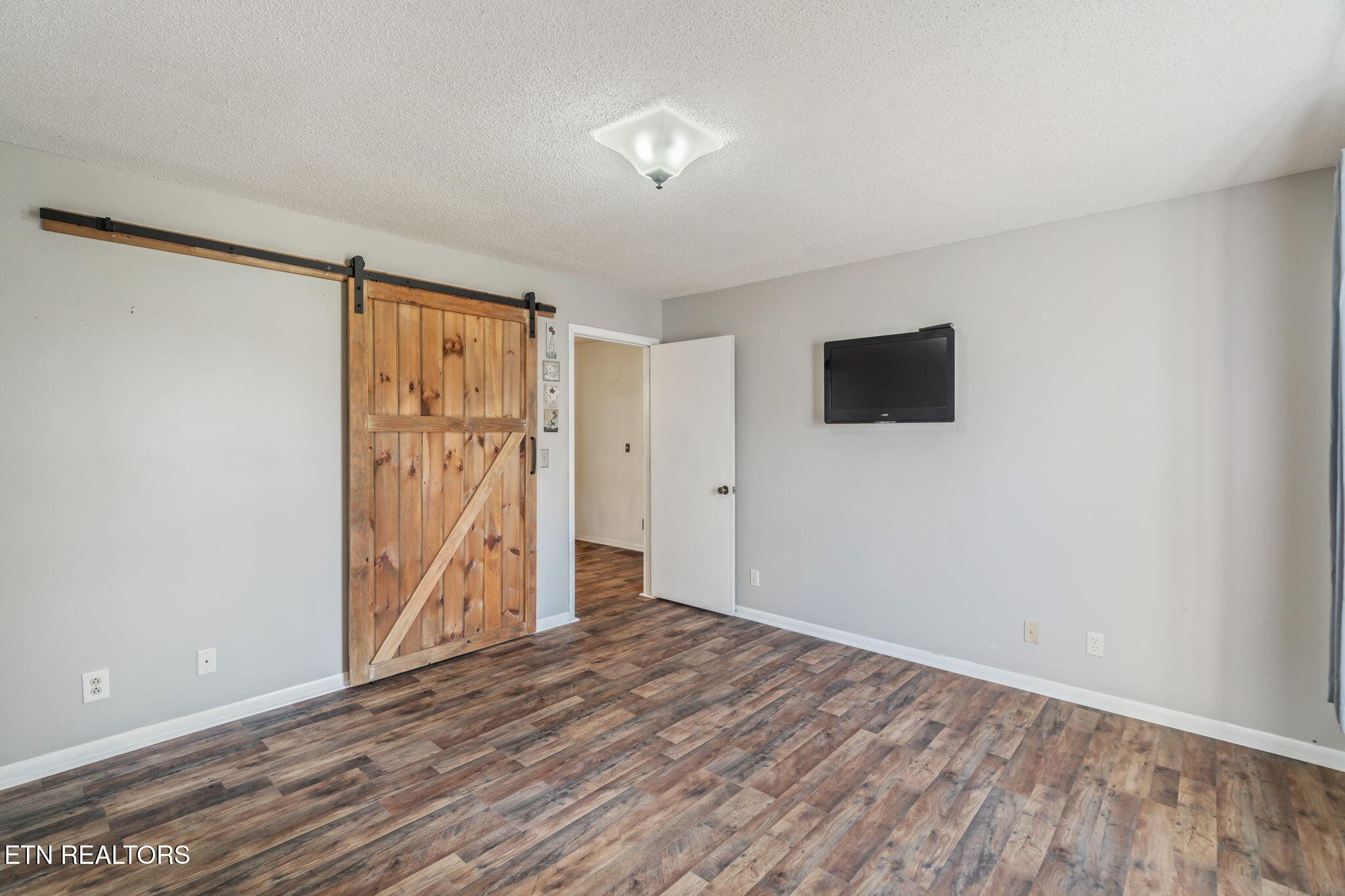 744 Butler Drive Loudon, TN 37774 - Photo 37 of 59 wooden floor in an empty room with a window