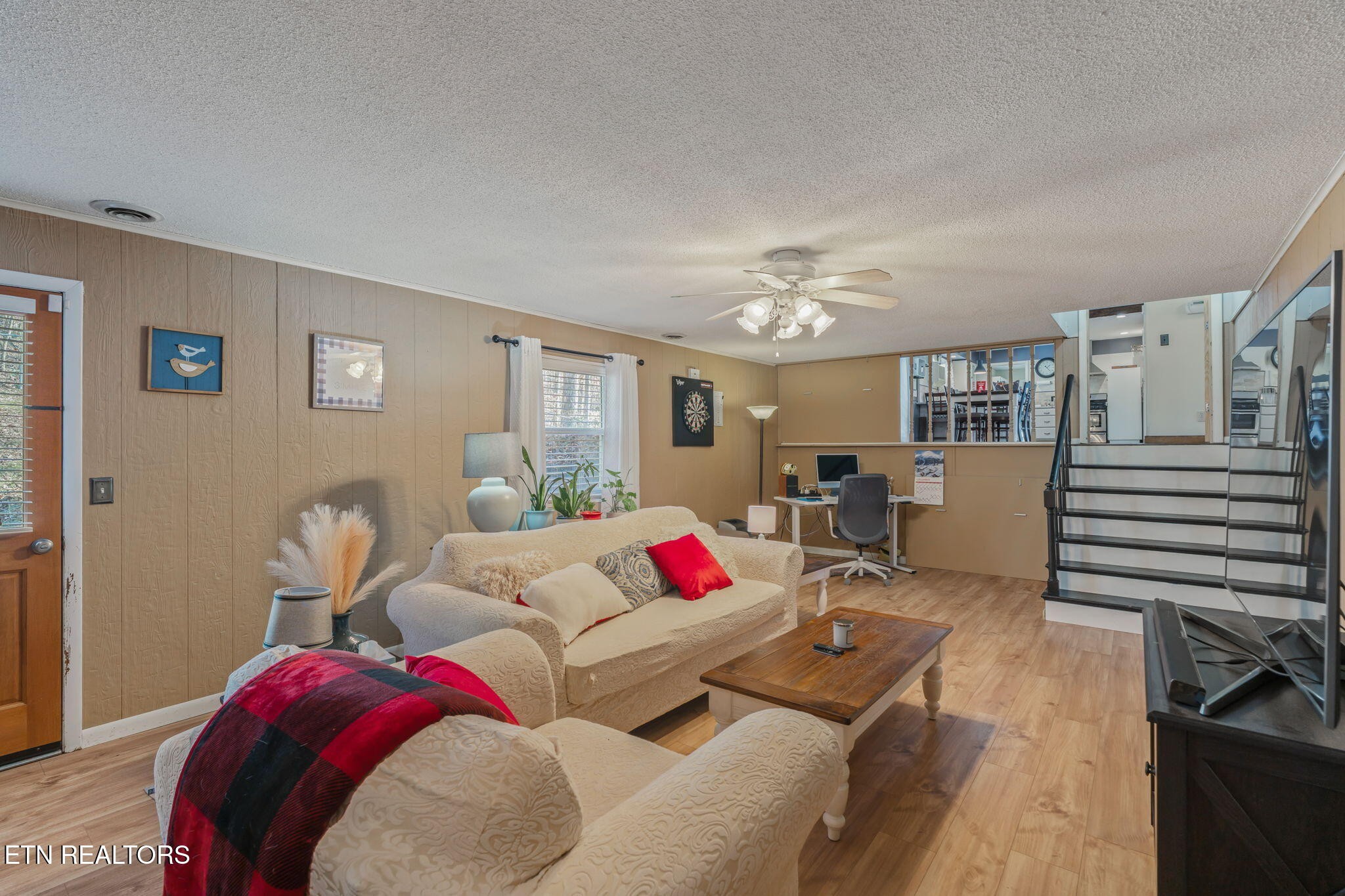 744 Butler Drive Loudon, TN 37774 - Photo 42 of 59 a living room with furniture and a chandelier