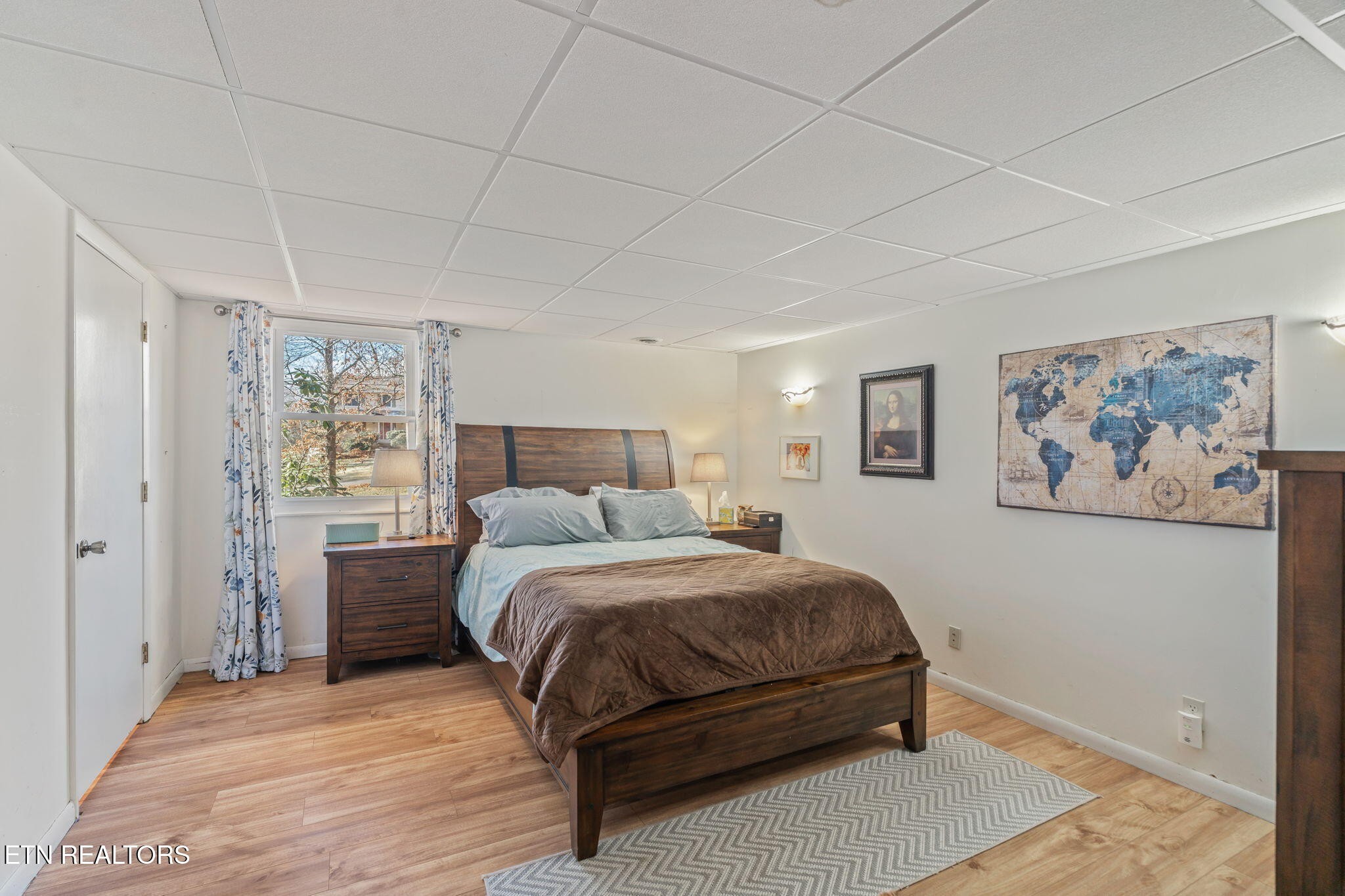 744 Butler Drive Loudon, TN 37774 - Photo 43 of 59 a bedroom with a bed and a painting on the wall