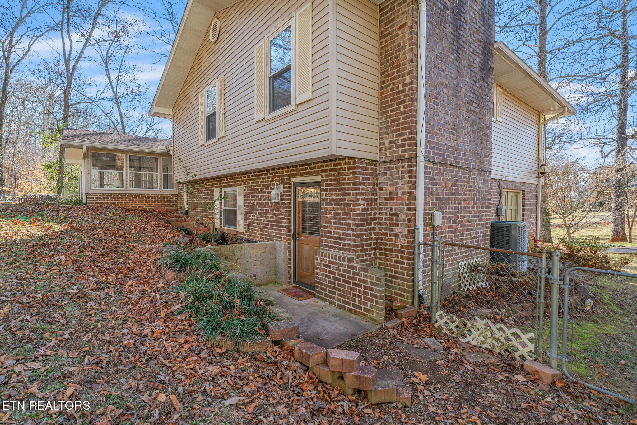 744 Butler Drive Loudon, TN 37774 - Photo 48 of 59 a view of a brick house with a yard