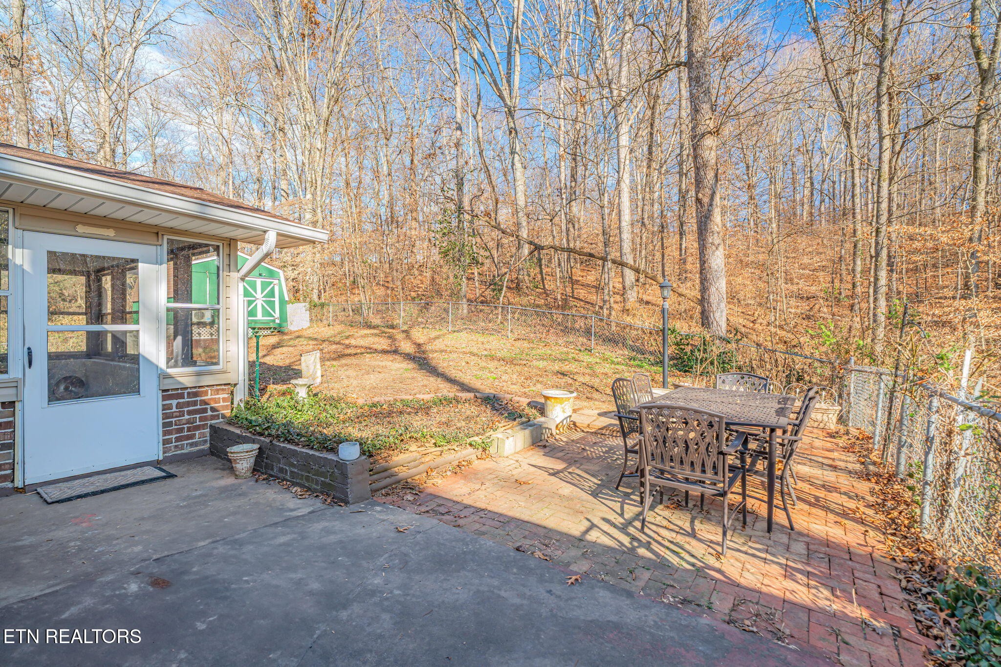 744 Butler Drive Loudon, TN 37774 - Photo 50 of 59 a view of a patio with table and chairs and potted plants