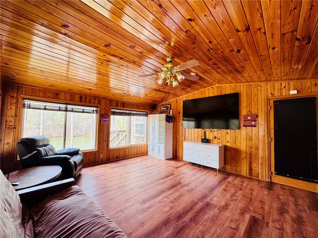 217 Wiles Road Abbeville, SC 29620 - Photo 17 of 50 This warm living space features wood paneling throughout and ample natural light.