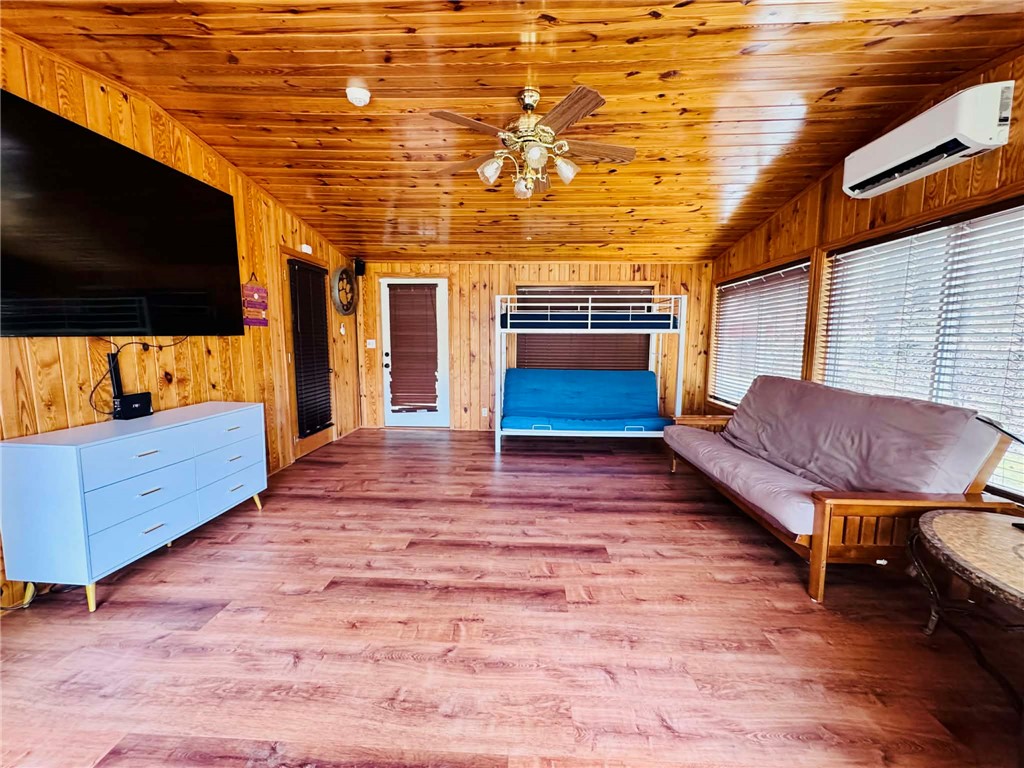 217 Wiles Road Abbeville, SC 29620 - Photo 50 of 50 This warm space features rich wood paneling and practical design elements, creating a comfortable living area.