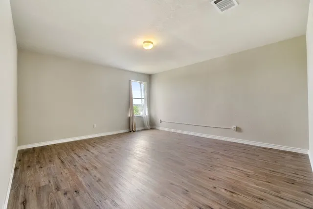 a view of an empty room and window