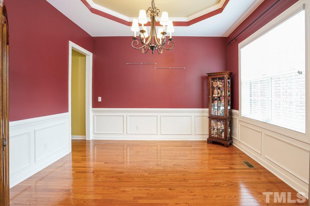 2920 Elmfield Street Raleigh, NC 27614 - Photo 4 of 30 The perfect place for hosting dinner parties or family meals. The dining room features a trey ceiling, chair rail and wainscoting, and a large double window.