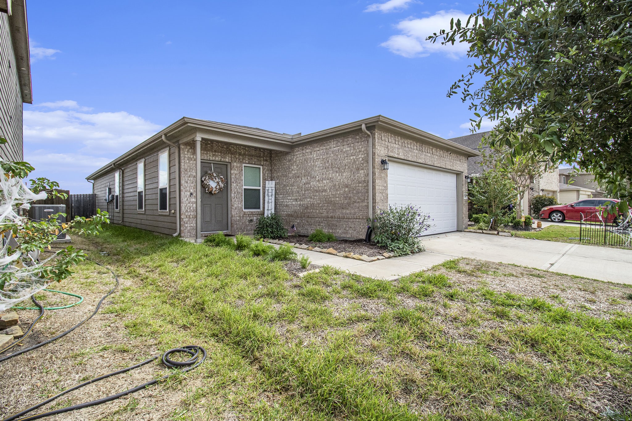 a front view of a house with garden
