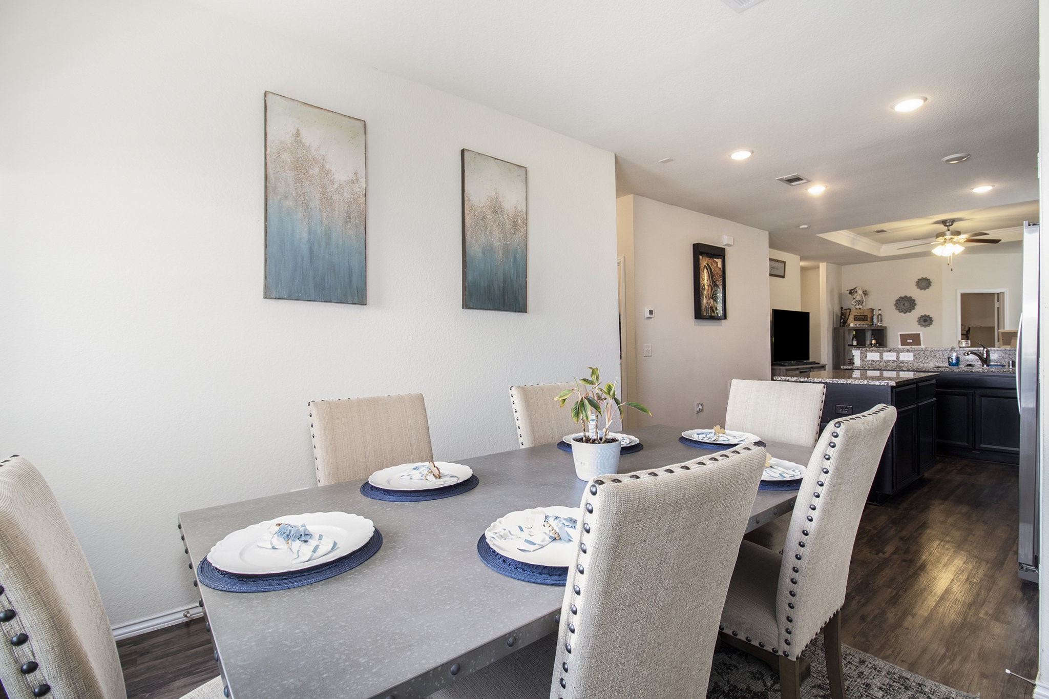 5726 Pampus Prairie Road Katy, TX 77493 - Photo 12 of 28 a dining room with furniture and wooden floor
