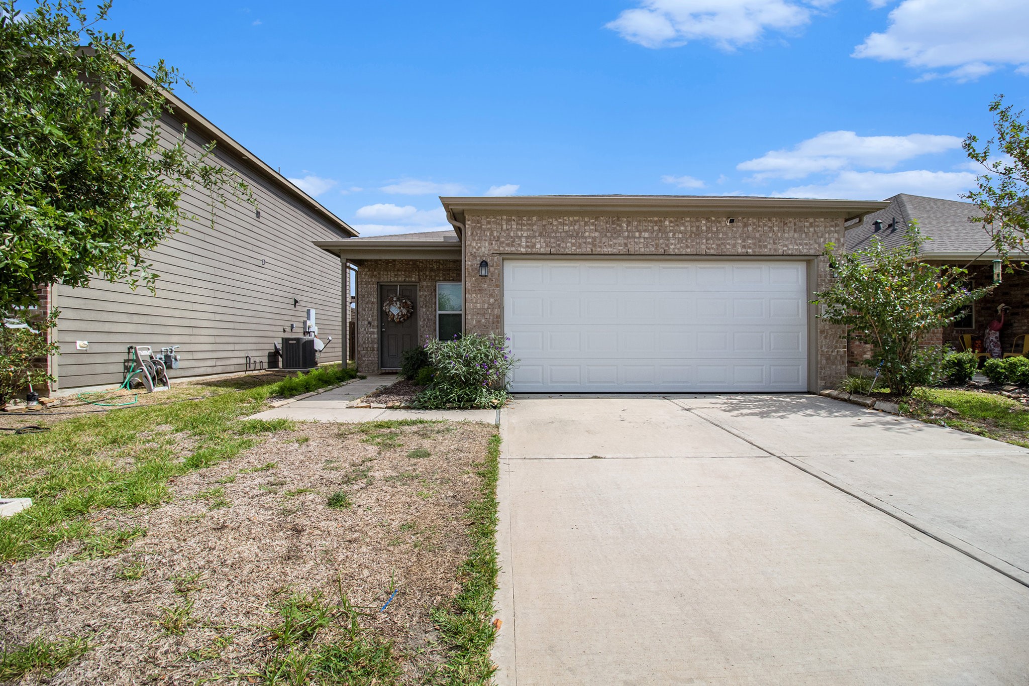 5726 Pampus Prairie Road Katy, TX 77493 - Photo 2 of 28 a front view of a house with a yard and garage