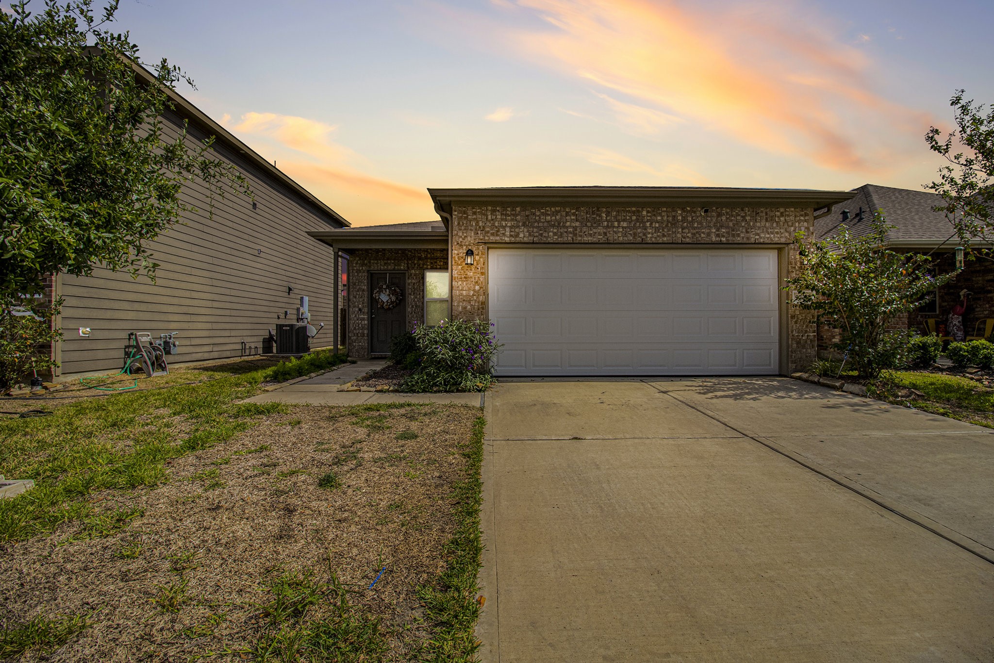 5726 Pampus Prairie Road Katy, TX 77493 - Photo 3 of 28 a front view of a house with a yard and garage