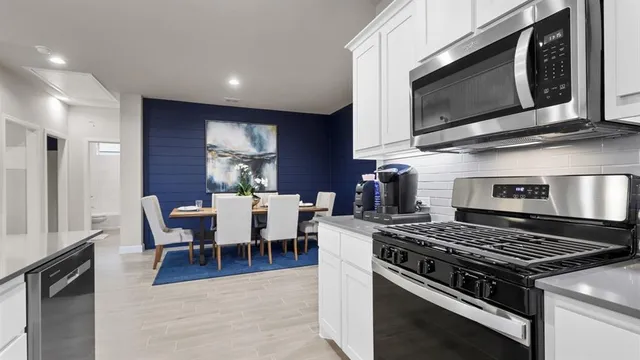 a kitchen with a sink and a refrigerator