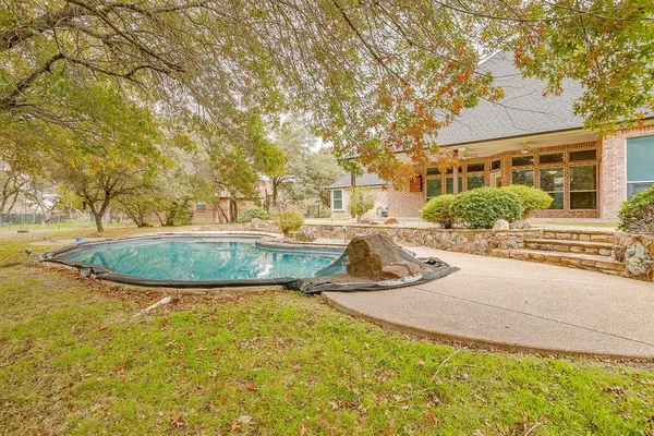 a view of a house with swimming pool