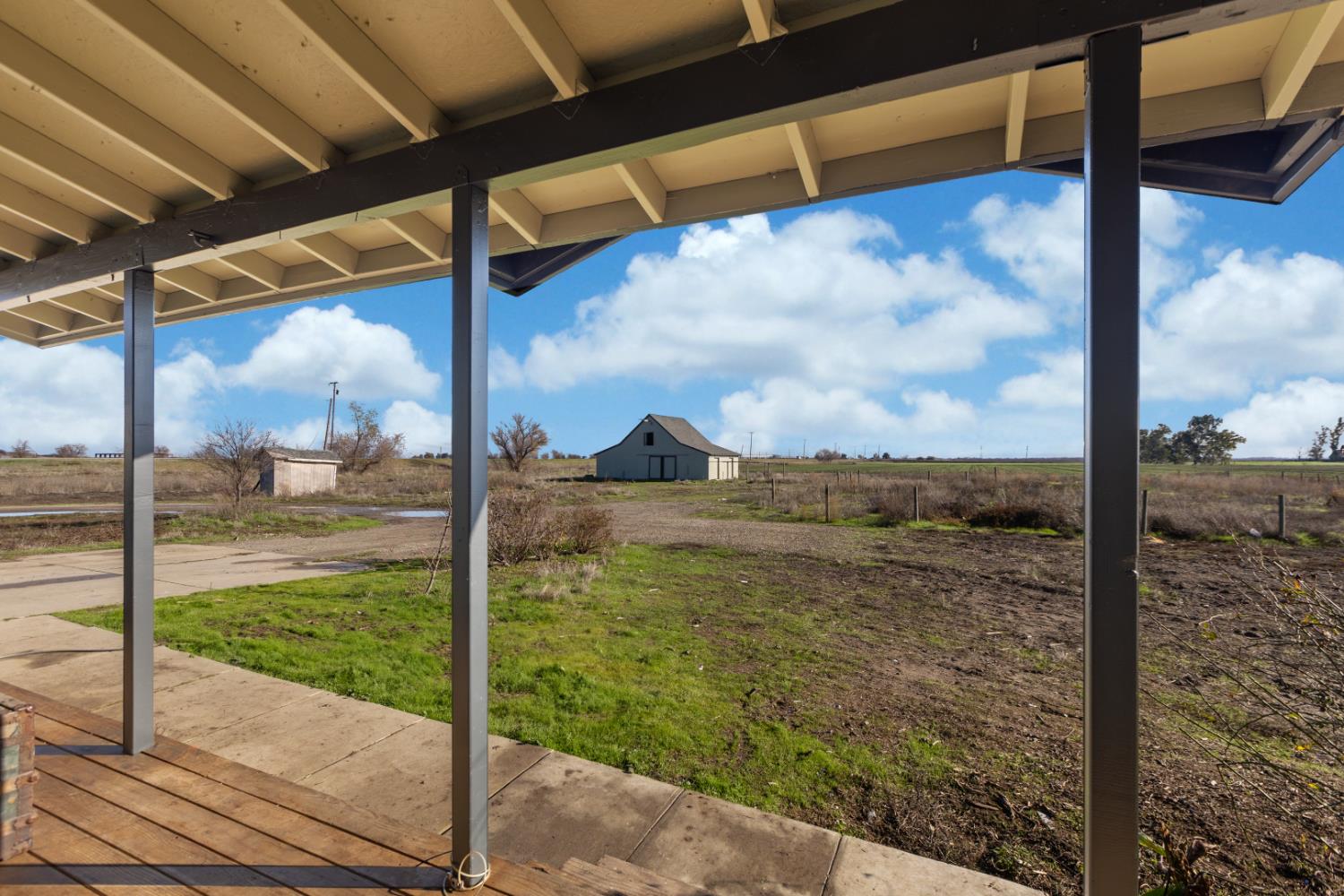 44643 County Road 29 Davis, CA 95618 - Photo 34 of 41 a view of a porch with a floor to ceiling window next to a yard