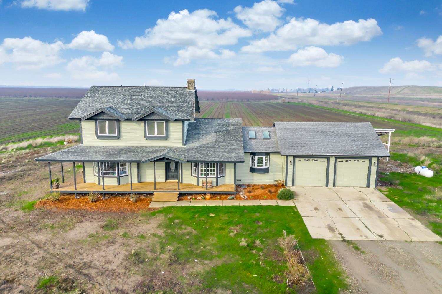 44643 County Road 29 Davis, CA 95618 - Photo 7 of 41 a front view of a house with a garden and lake view