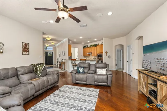 a living room with furniture and a rug