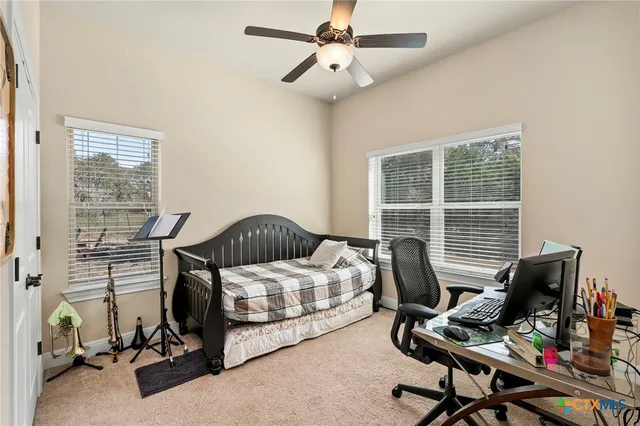 a bedroom with a workspace