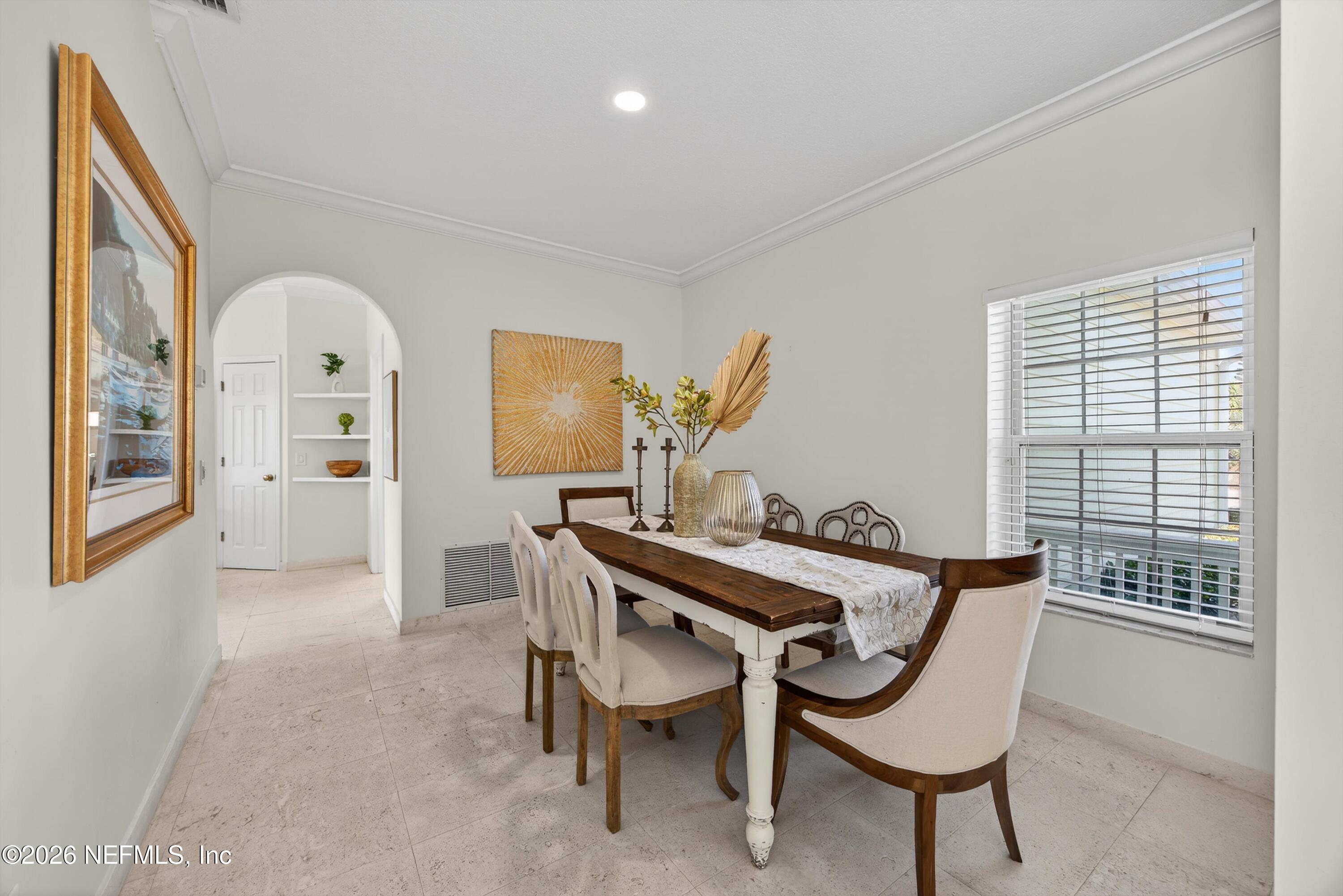9179 June Lane St. Augustine, FL 32080 - Photo 14 of 56 a view of a dining room with furniture and window