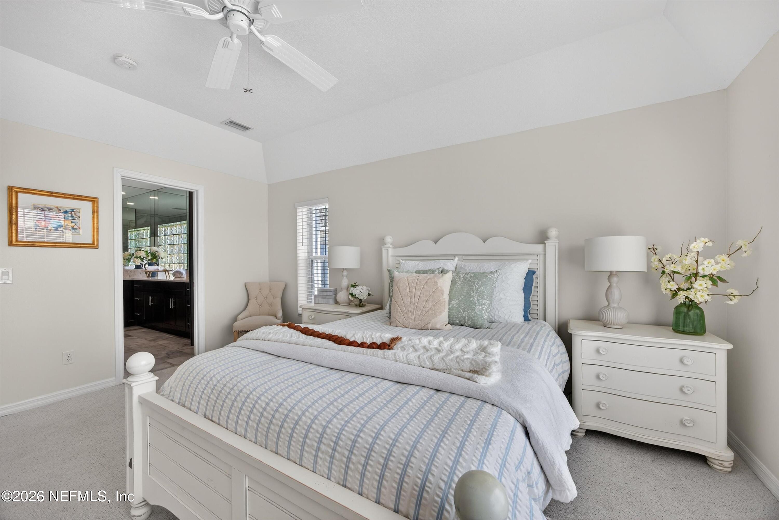 9179 June Lane St. Augustine, FL 32080 - Photo 15 of 56 a bedroom with a bed and ceiling fan
