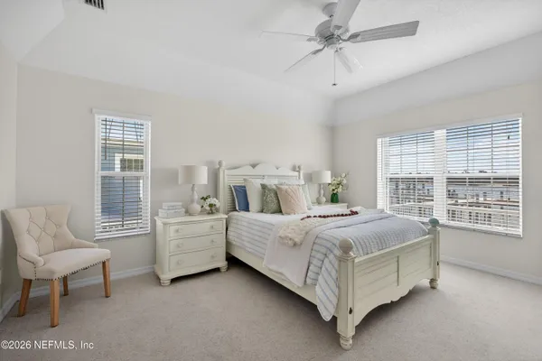 a en suite bathroom with a double vanity sink a large mirror and shower