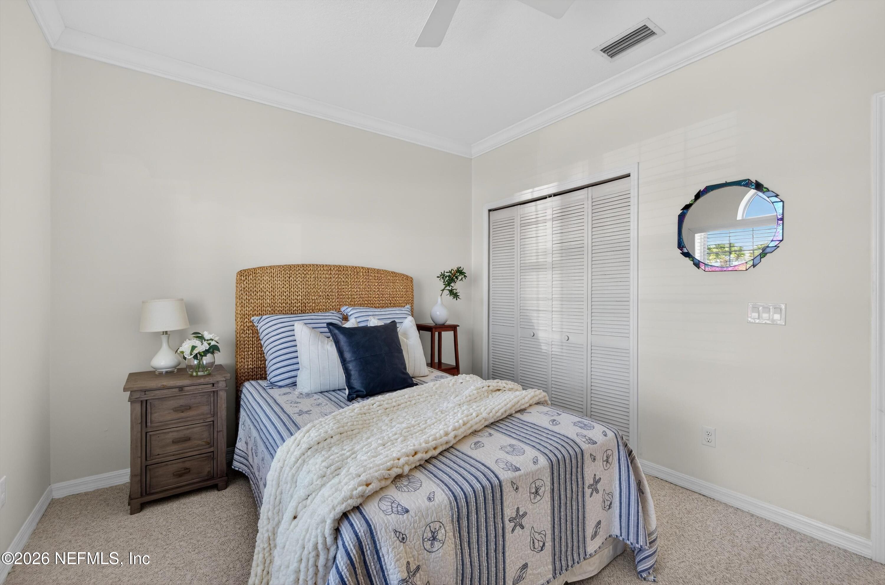 9179 June Lane St. Augustine, FL 32080 - Photo 20 of 56 a bedroom with a bed and a window