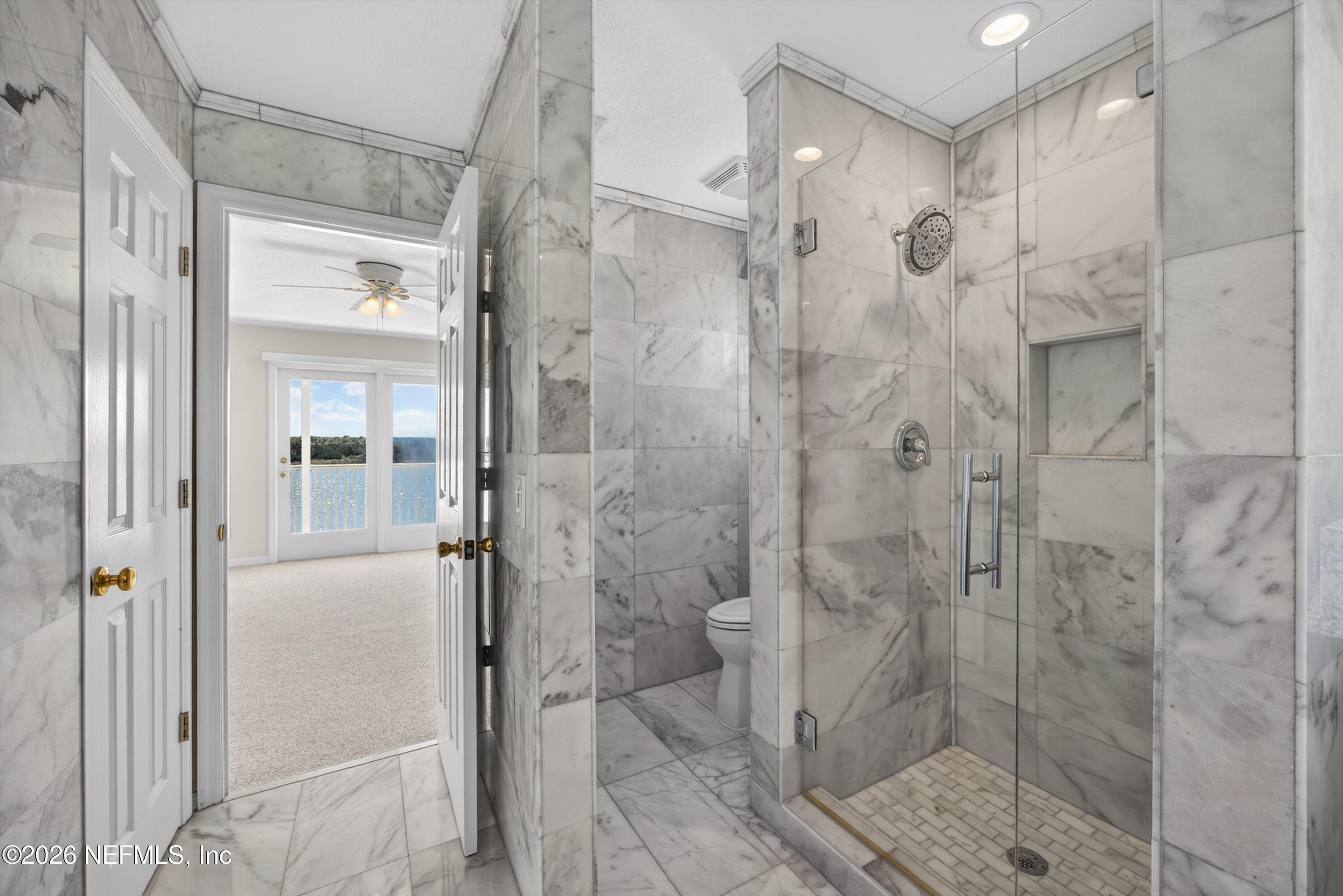 9179 June Lane St. Augustine, FL 32080 - Photo 28 of 56 a bathroom with a shower