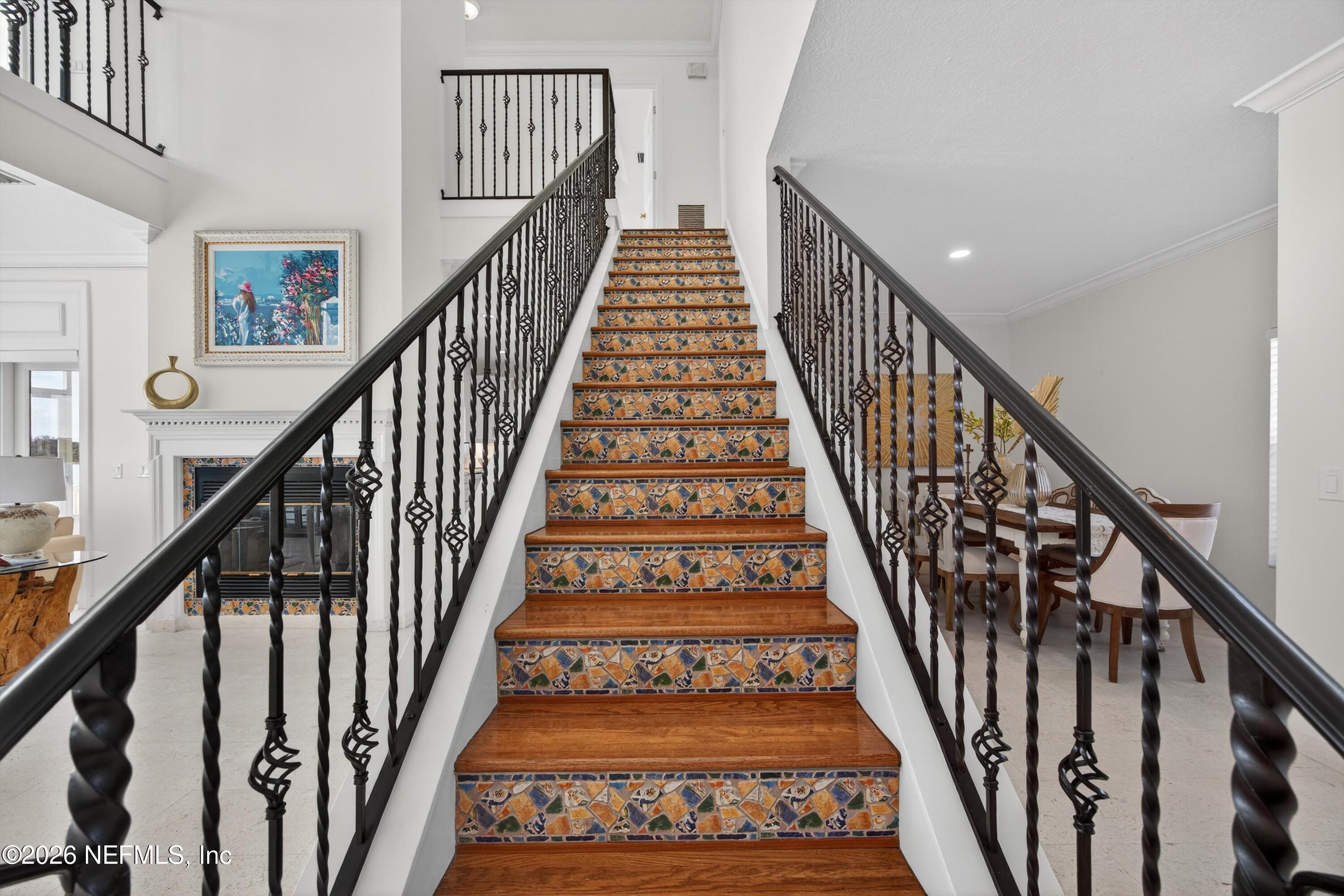 9179 June Lane St. Augustine, FL 32080 - Photo 29 of 56 a view of staircase with wooden floor and a rug