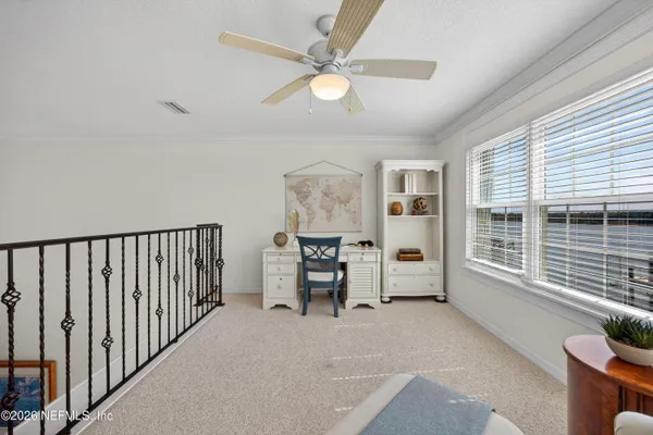a view of a balcony with wooden floor