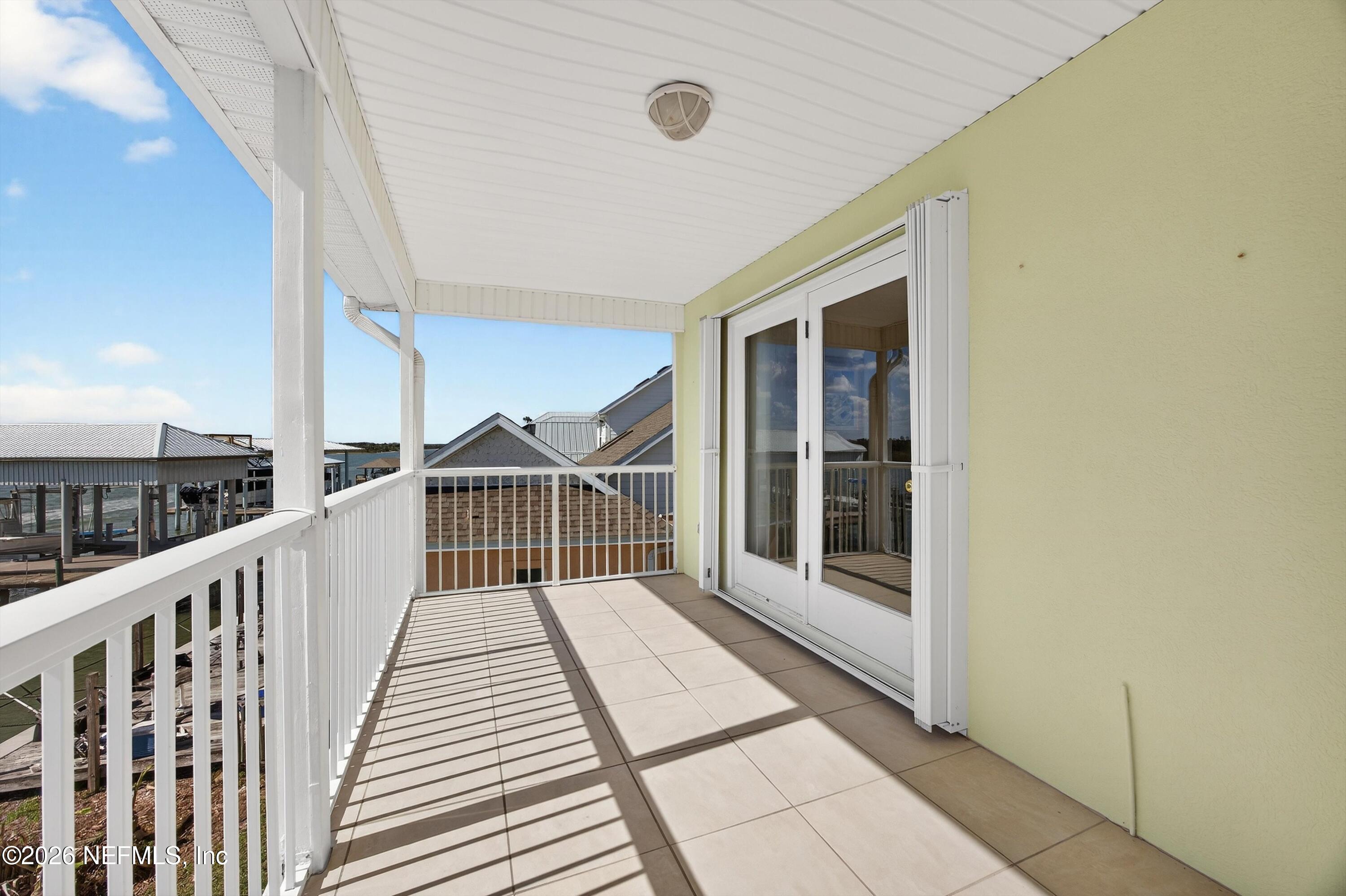 9179 June Lane St. Augustine, FL 32080 - Photo 33 of 56 a view of a balcony with wooden floor