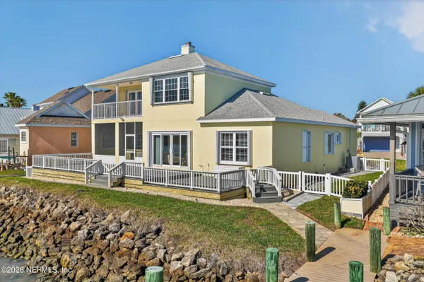an aerial view of a house with lake view