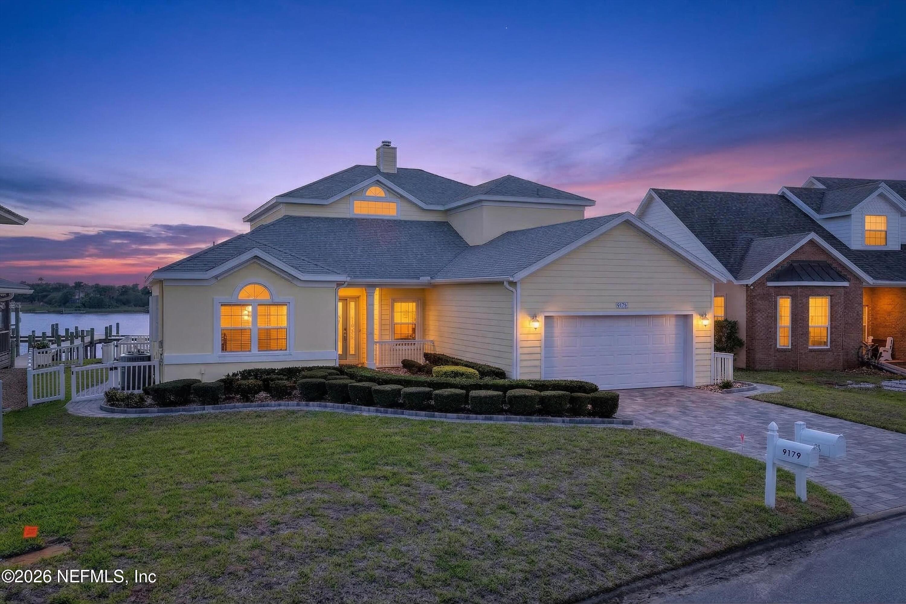 9179 June Lane St. Augustine, FL 32080 - Photo 37 of 56 a front view of a house with a yard