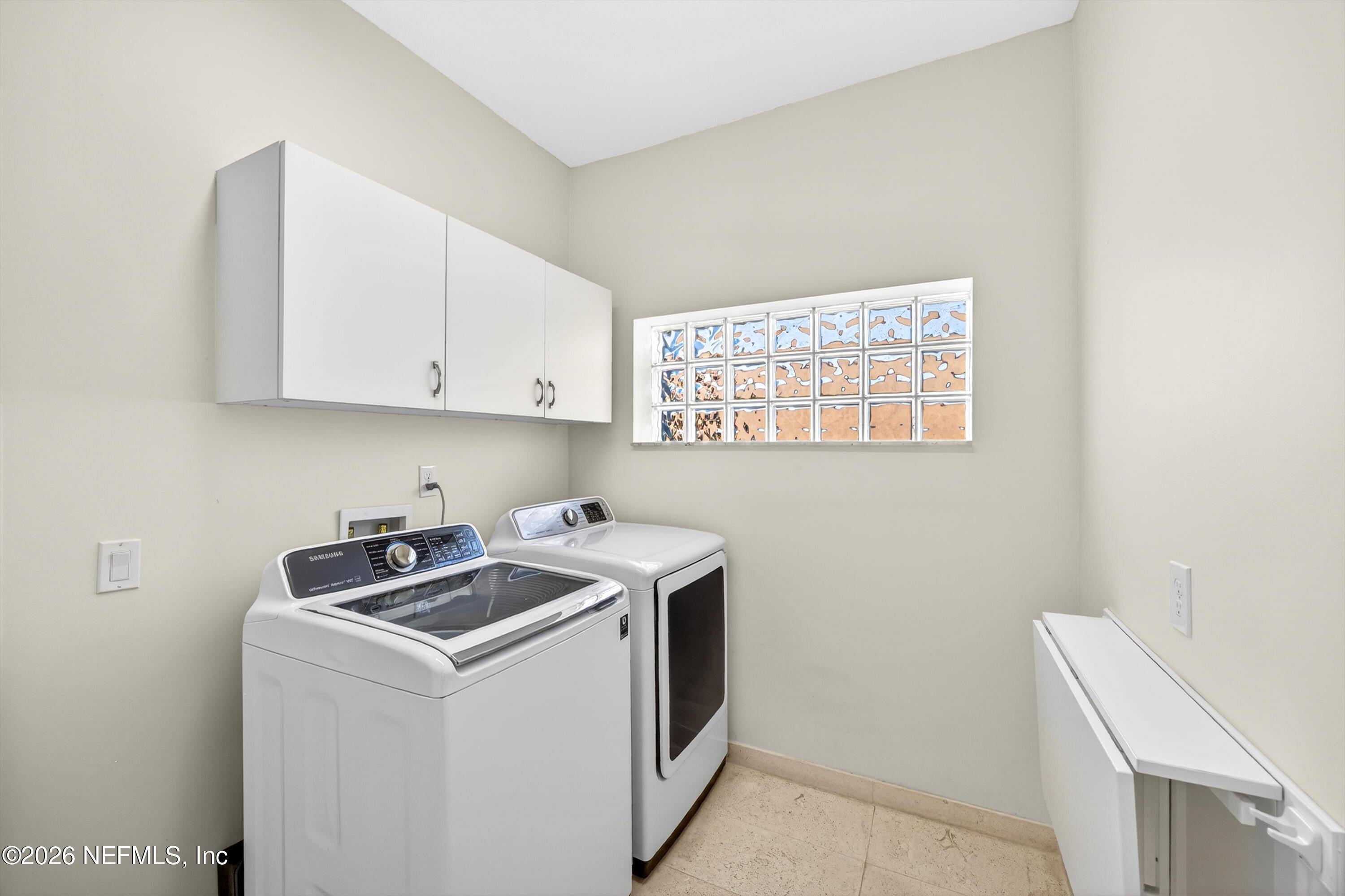 9179 June Lane St. Augustine, FL 32080 - Photo 38 of 56 a utility room with dryer and washer