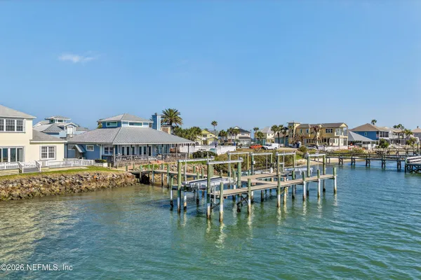 a view of a swimming pool with outdoor seating
