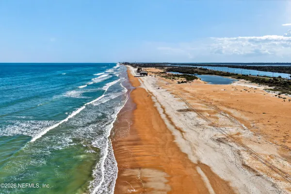 a view of a swimming pool with outdoor seating space