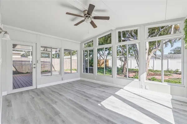 a view of an entryway with wooden floor and door