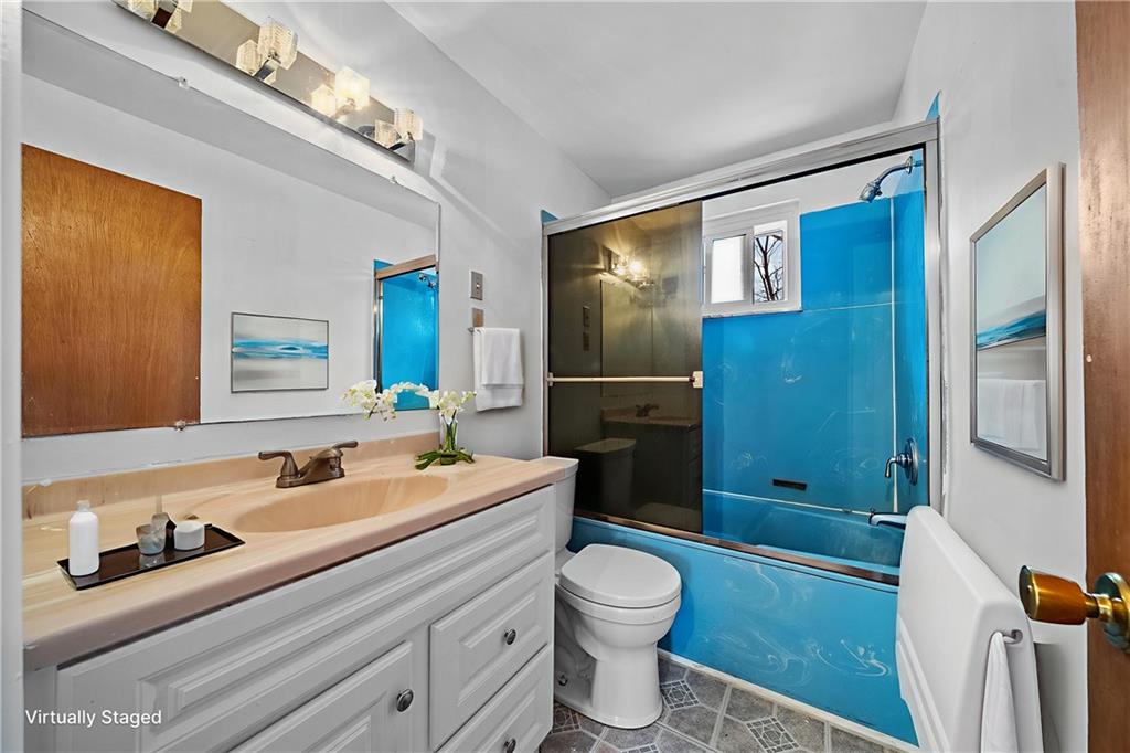 1041 Ardmore Manor Drive Pittsburgh, PA 15221 - Photo 20 of 38 a bathroom with a toilet sink and mirror