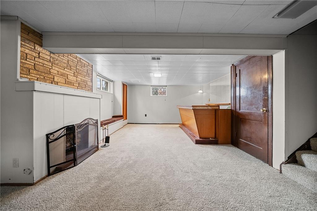 1041 Ardmore Manor Drive Pittsburgh, PA 15221 - Photo 27 of 38 a view of a refrigerator in kitchen and an empty room