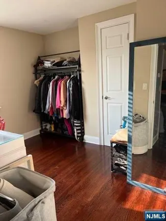 a living room with furniture and gym equipment