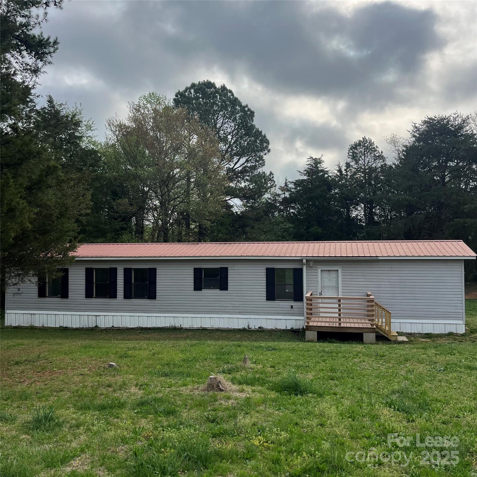 124 Saylor Lane Stony Point, NC 28678 - Photo 1 of 11 a view of a house with a backyard