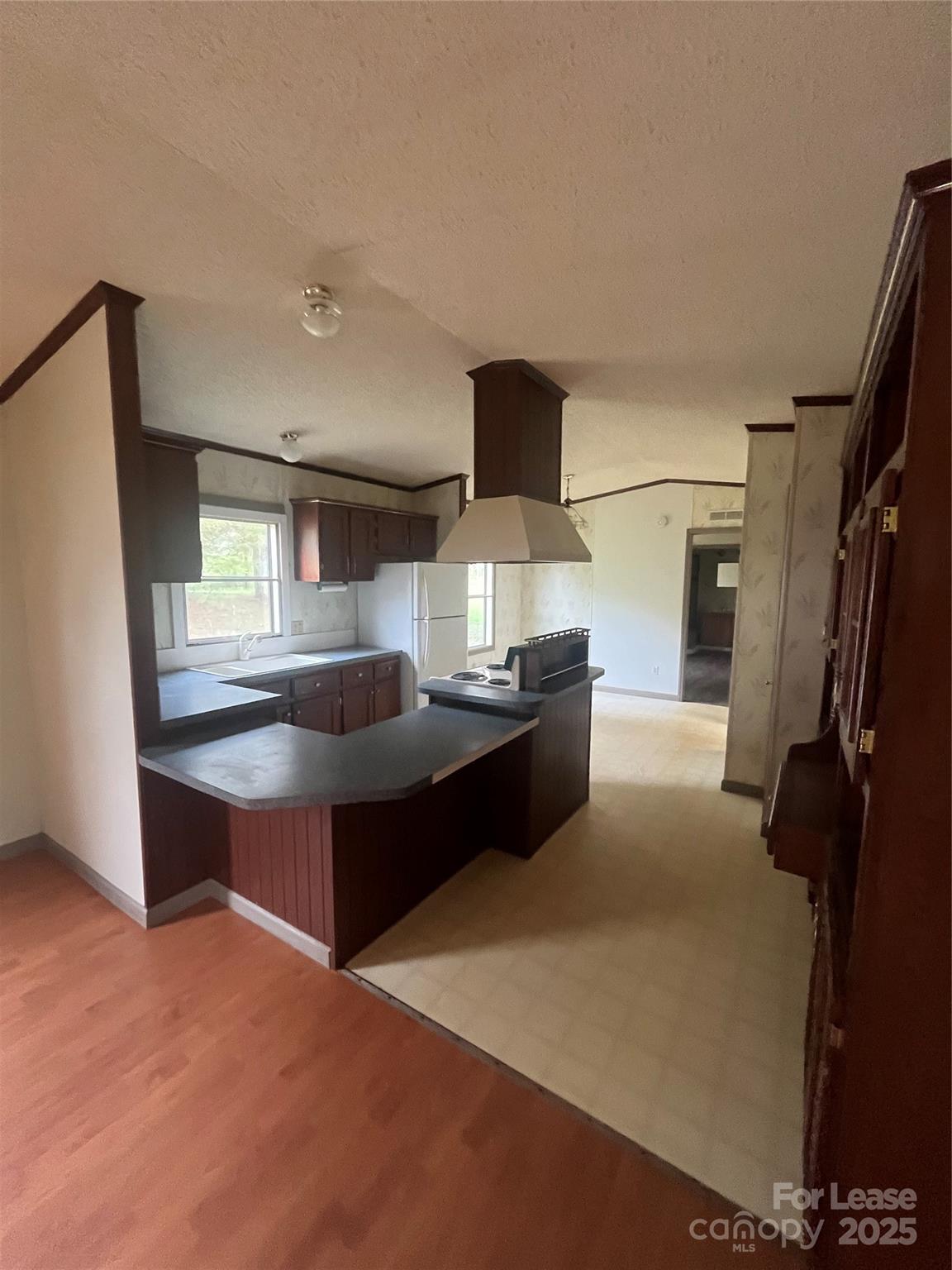 124 Saylor Lane Stony Point, NC 28678 - Photo 3 of 11 a kitchen with a stove and a refrigerator