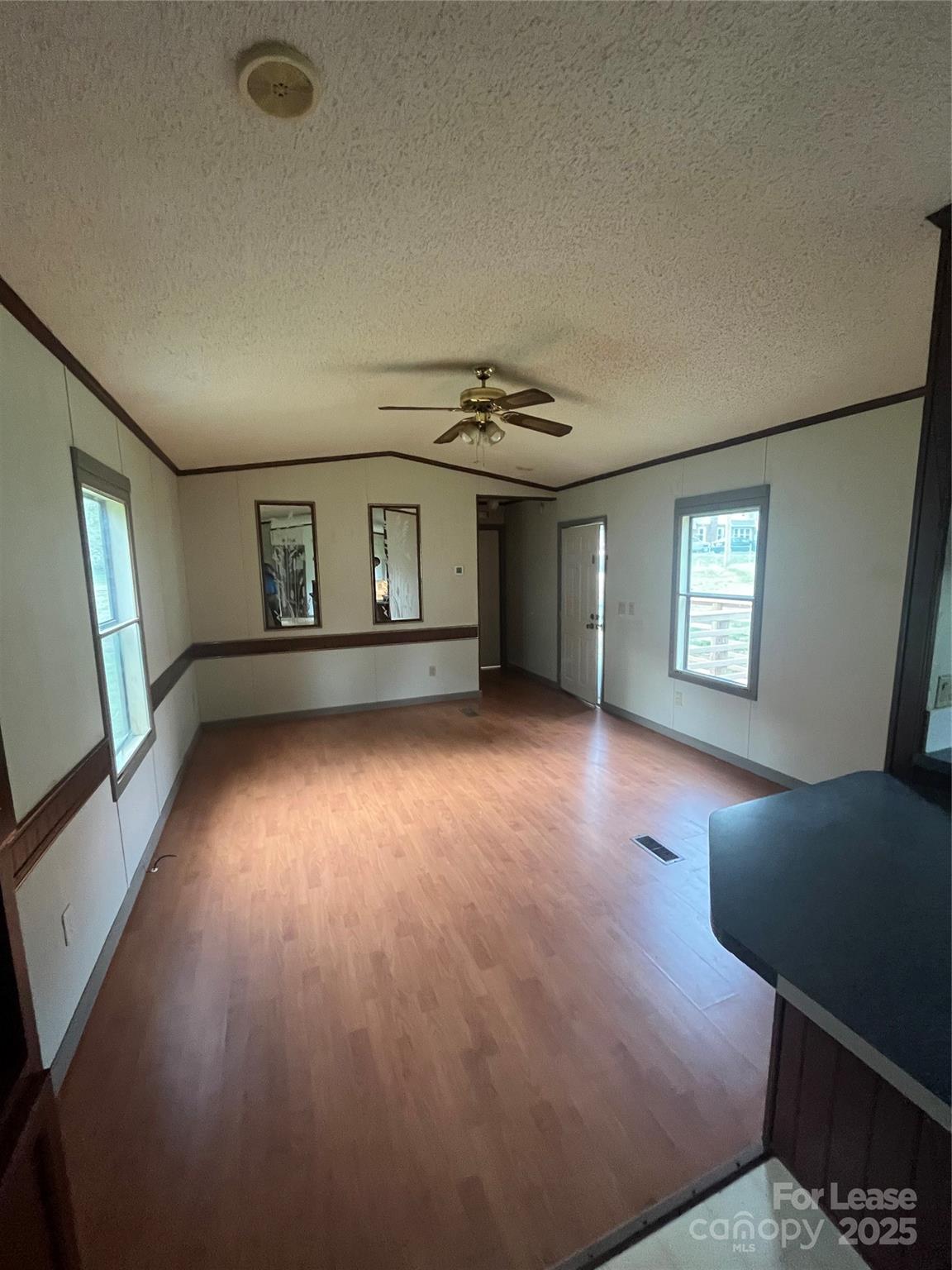 124 Saylor Lane Stony Point, NC 28678 - Photo 8 of 11 a view of livingroom with hardwood floor and hallway