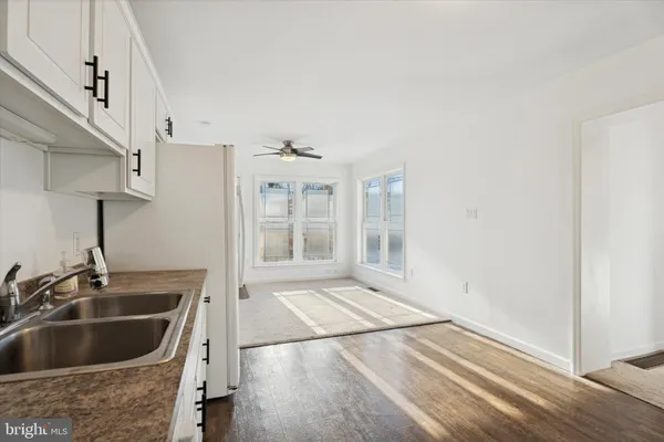a kitchen with granite countertop a sink and a window