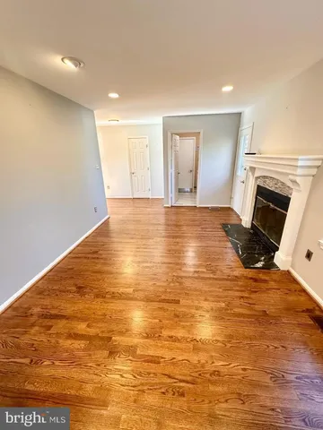 a bathroom with a sink mirror and toilet